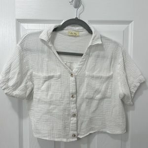Short, white, button up shirt.